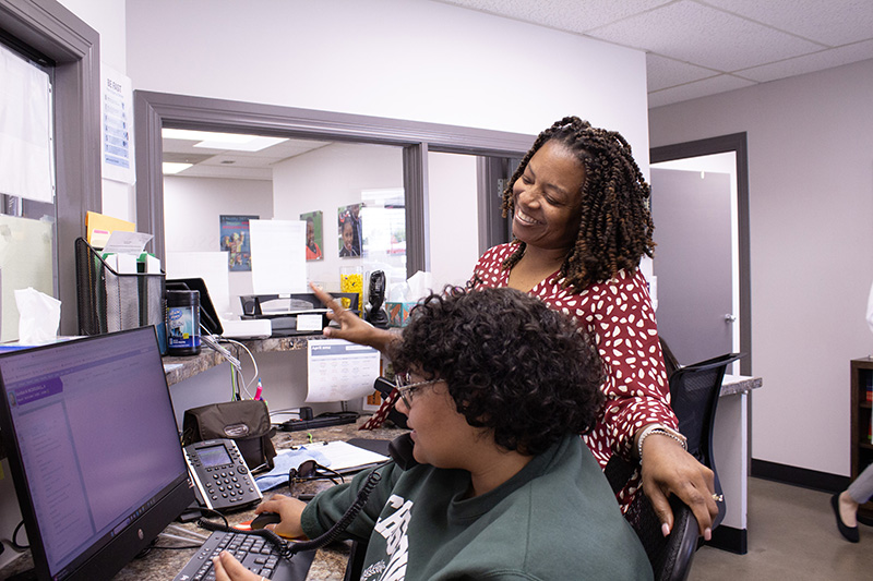 in-office staff at computer