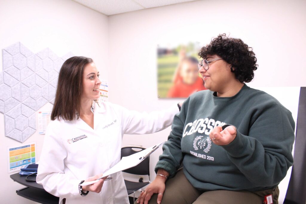 doctor listening to female patient