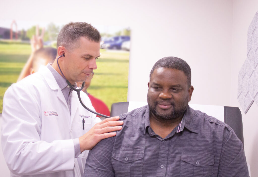 doctor tending to male patient