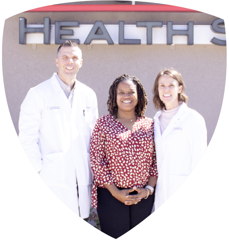 Crossover Health Services staff standing in front of the clinic